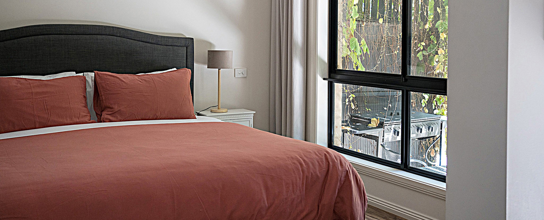 9a-King-sized-bed-looking-out-through-double-glazed-windows-to-your-own-private-fully-fenced-garden