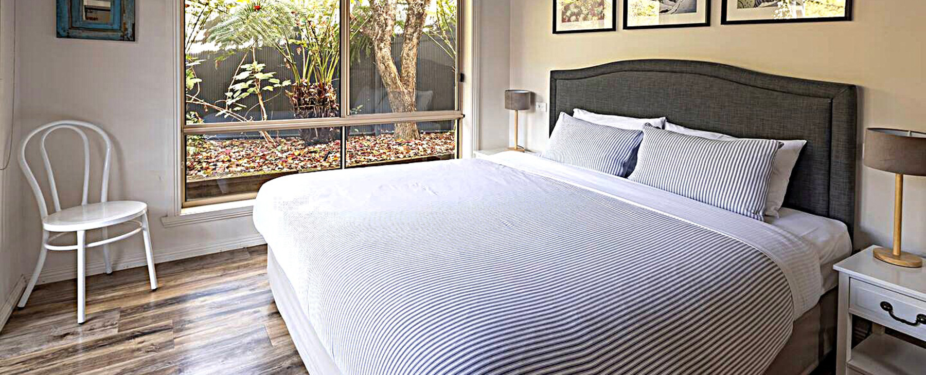 25a--Bedroom-1.--King-size-bed-looking-over-the-garden-and-pool