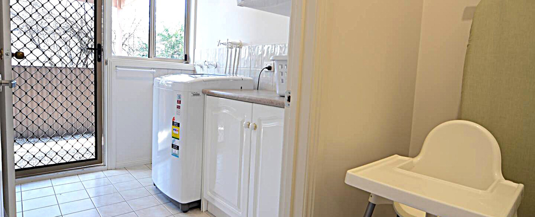 36a.--Large,-new-family-size-washing-machine-and-clothes-dryer.--Clothes-line-outside-the-laundry-door.