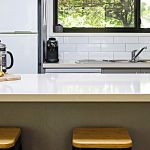 10a-New-kitchen-with-gas-cooking,-Nespresso-coffee-machine,-full-fridge-and-outlook-to-BBQ-and-back-garden